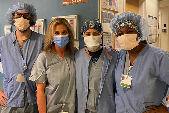 Four nurses wearing masks